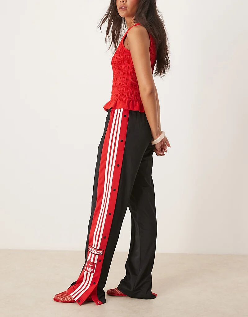 

Спортивные брюки adidas Originals Adibreak черного и красного цветов