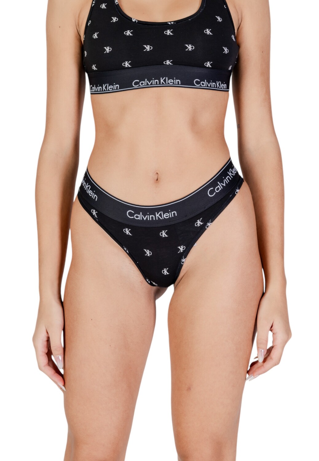 

Трусы женские Calvin Klein стринги с принтом, черный
