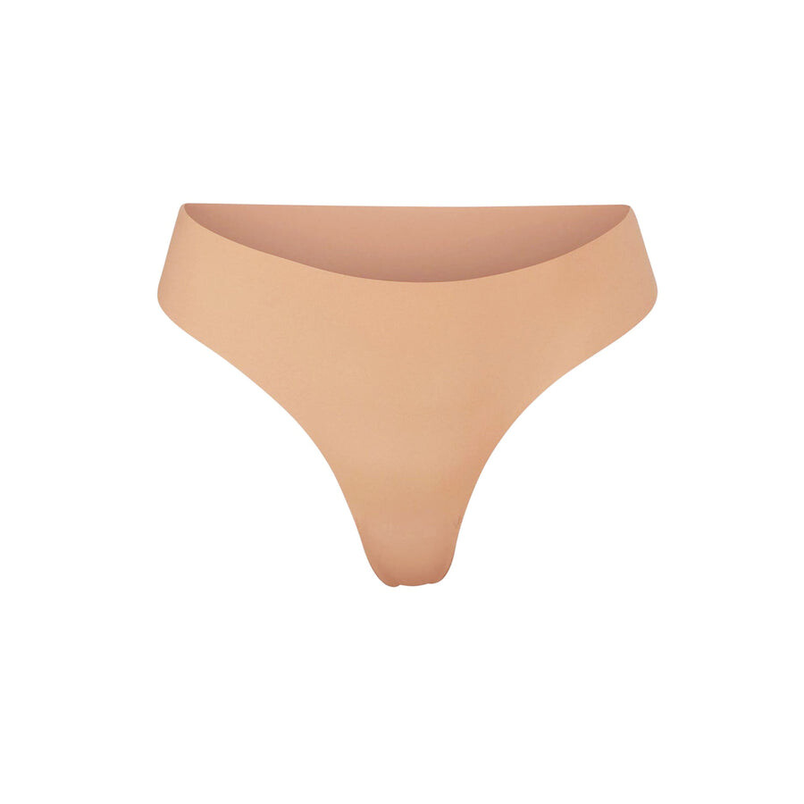 

Стринги с окучиванием SKIMS Naked, охра