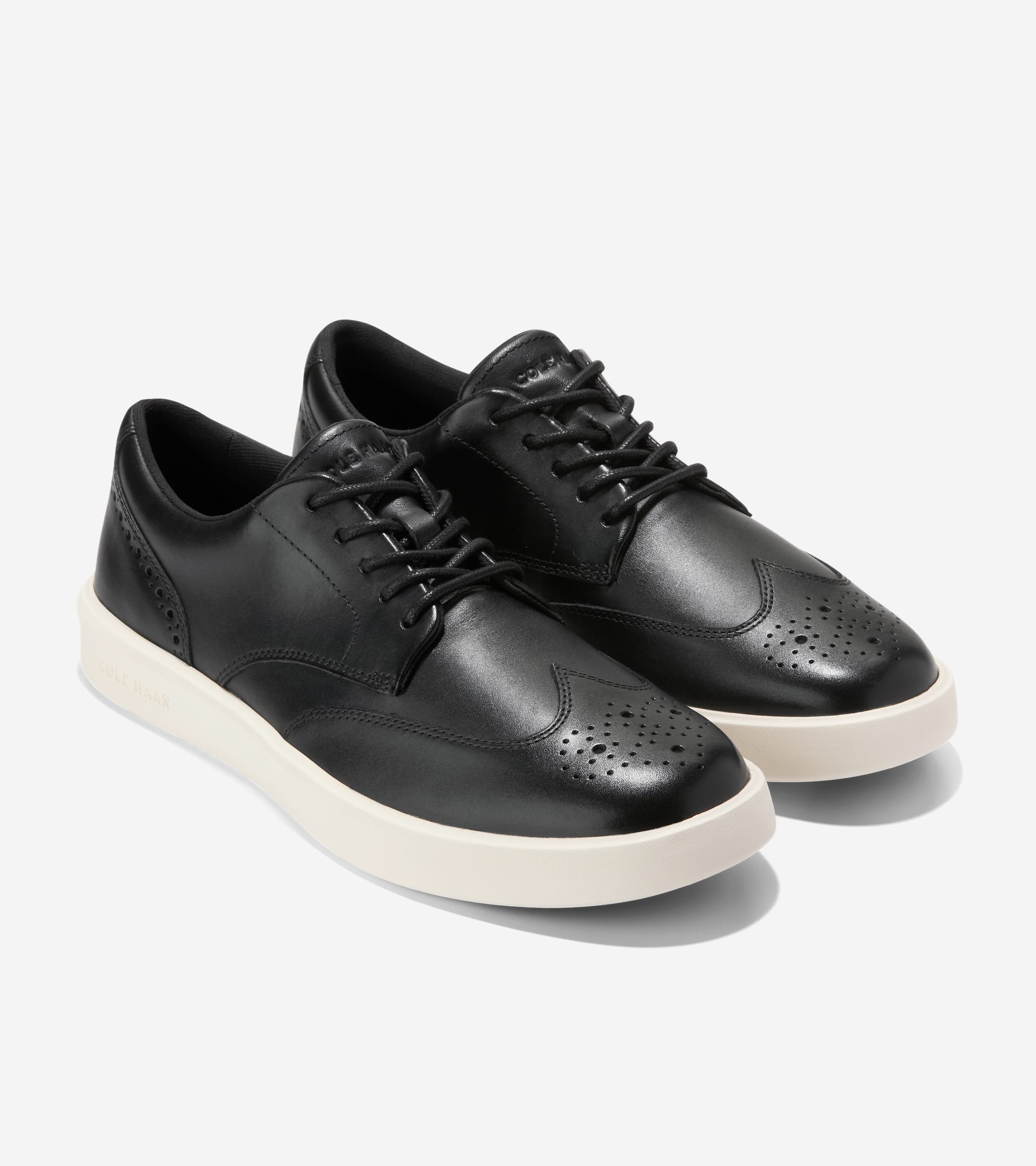 

Cole Haan Мужские повседневные кроссовки Wingtip Grand Crosscourt, черный/слоновая кость