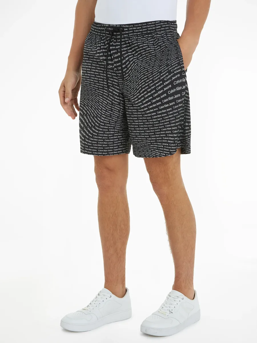 

Толстовки Calvin Klein Jeans "AOP SHORT" с надписью-логотипом, цвет Warp Logo Aop Black