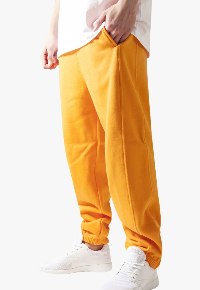 

Брюки для бега SWEATPANTS SP Urban Classics, цвет orange