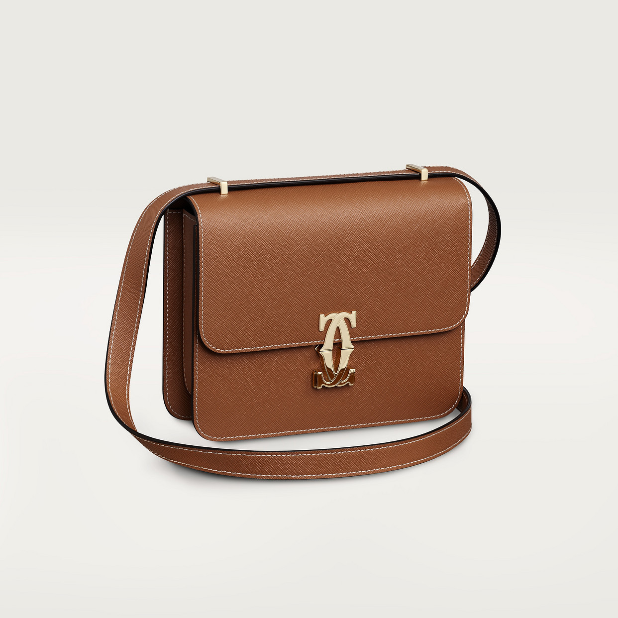 

Женская сумка через плечо Cartier Sac porté épaule mini modèle, C de Cartier, текстурированная телячья кожа карамельного цвета с золотой отделкой