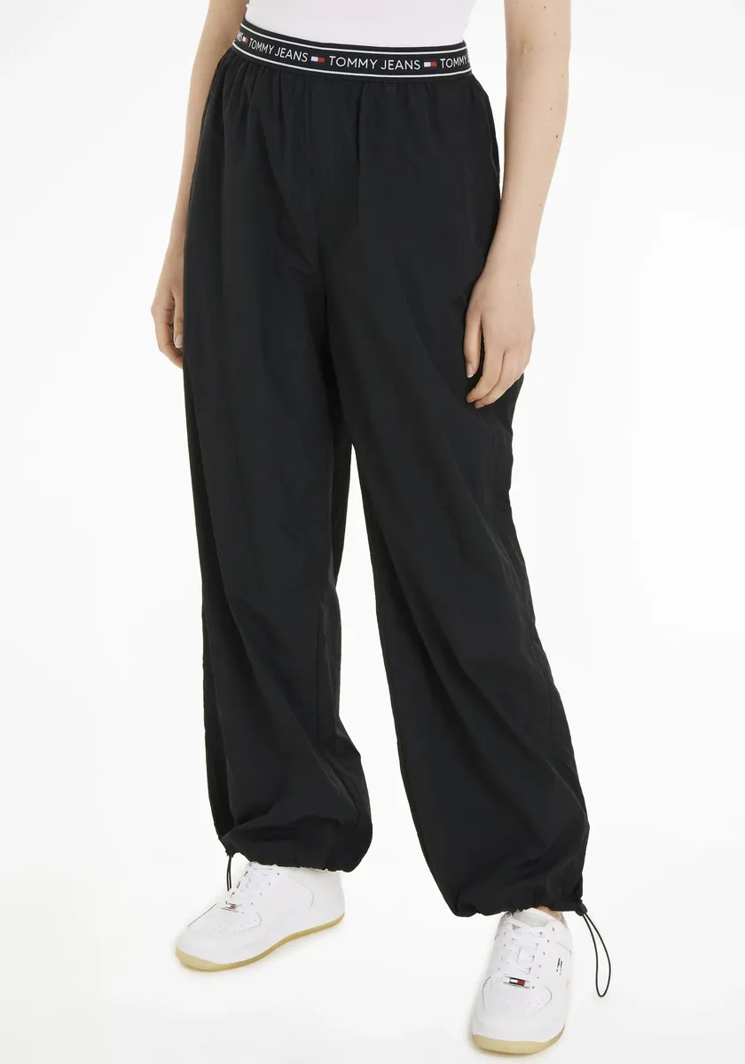 

Тканые брюки Tommy Jeans Curve "TJW BAGGY TAPING TRACKPANT EXT", черный