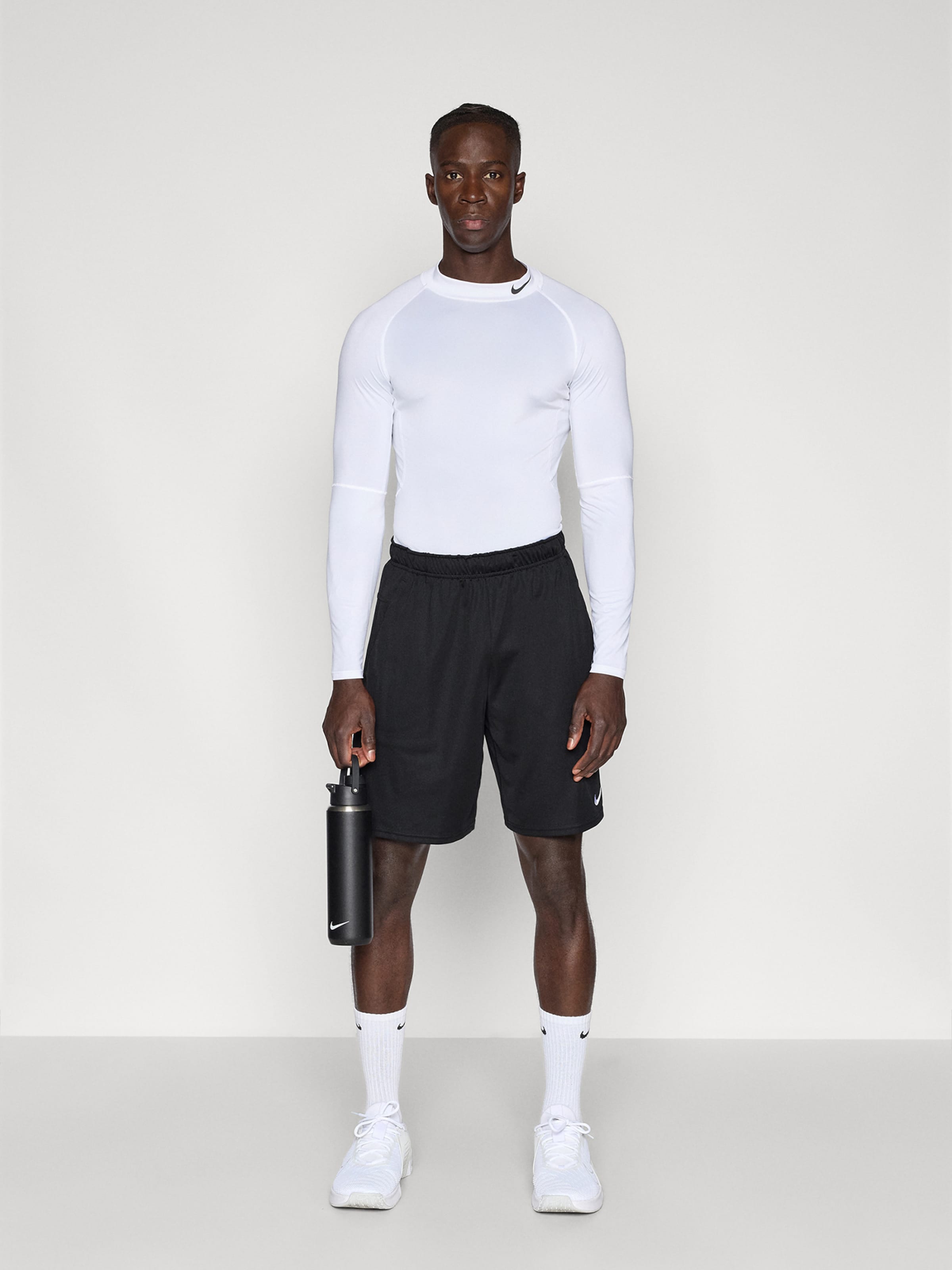 NIKE Шорты для тренировок 'FLEX' свободного кроя в черном цвете — фото 4