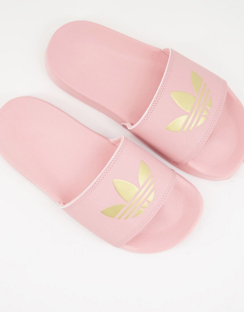 

Розовые шлепанцы adidas Adilette lite с золотым трилистником