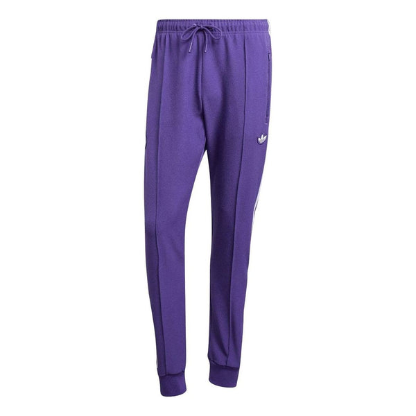 

Брюки real madrid terrace icons track Adidas, фиолетовый