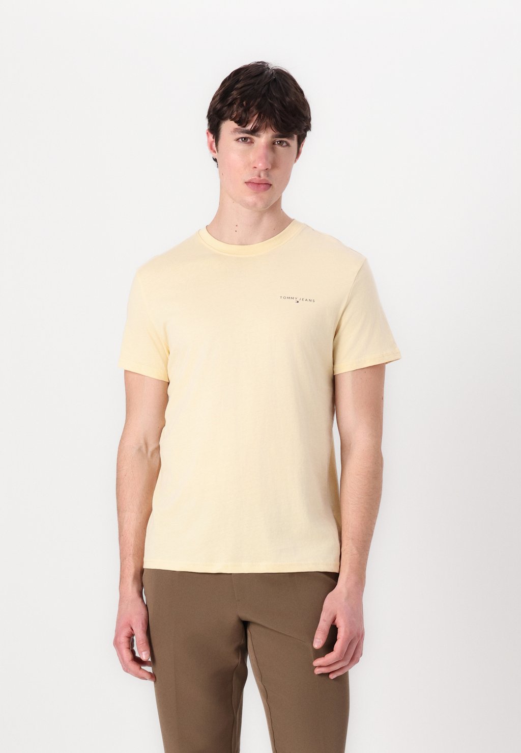 

Базовая футболка SLIM LINEAR CHEST TEE Tommy Jeans, светло-желтый