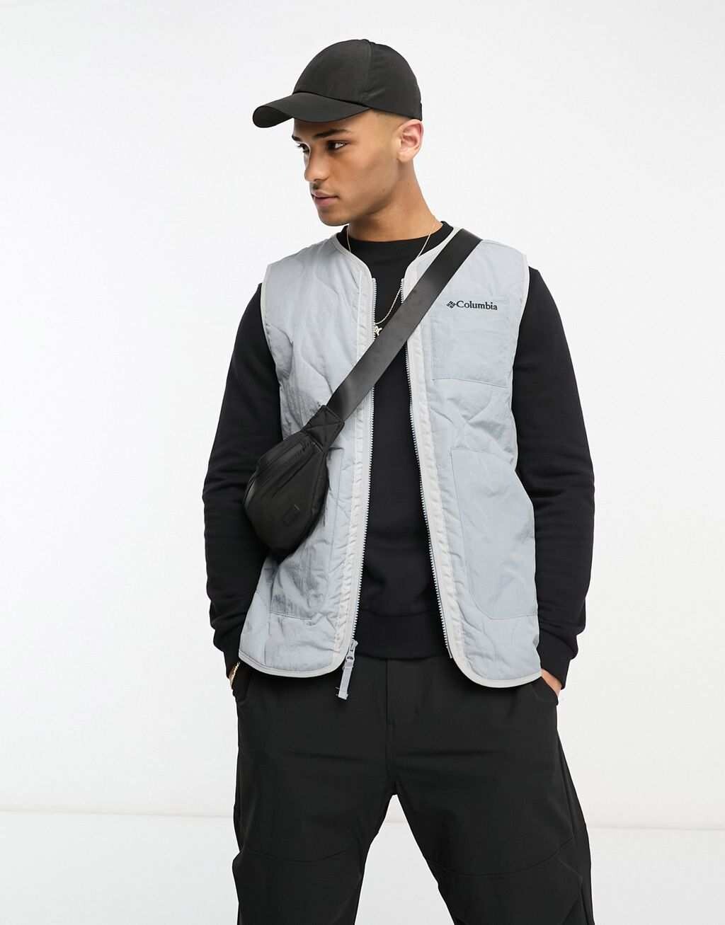 

Серый жилет со стеганой подкладкой из мятой ткани Columbia Doverwood эксклюзивно на ASOS