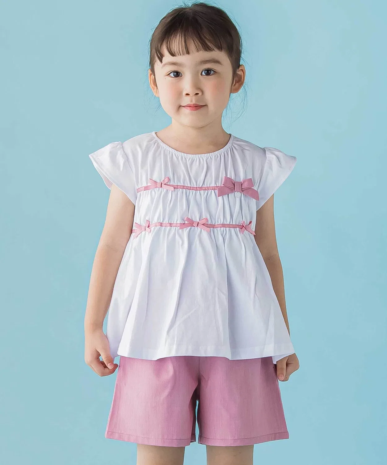 Детский комплект: топ с рюшами и бантом + юбка-шорты, BeBe Petits Pois Vert, 95-150 см, розовый