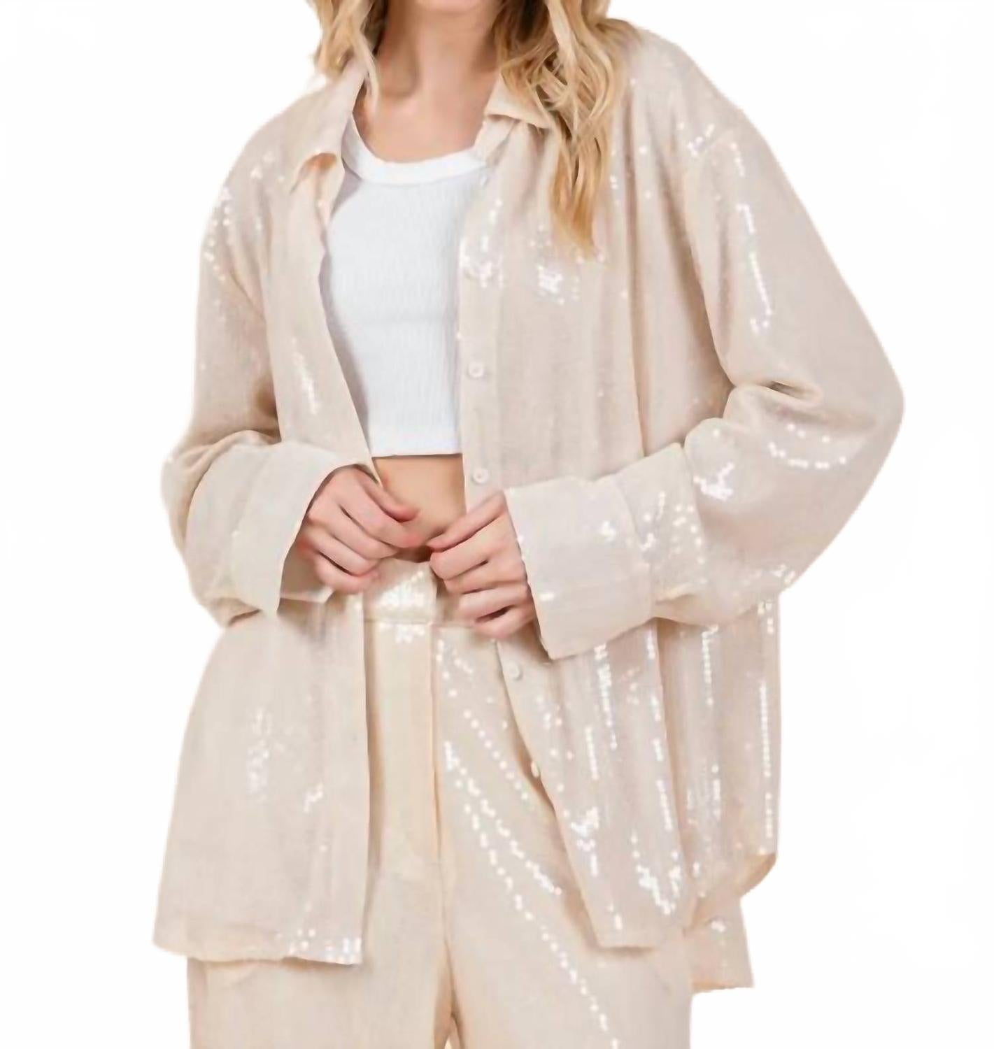 

Кремовая блуза с пайетками и объемными пуговицами GEEGEE