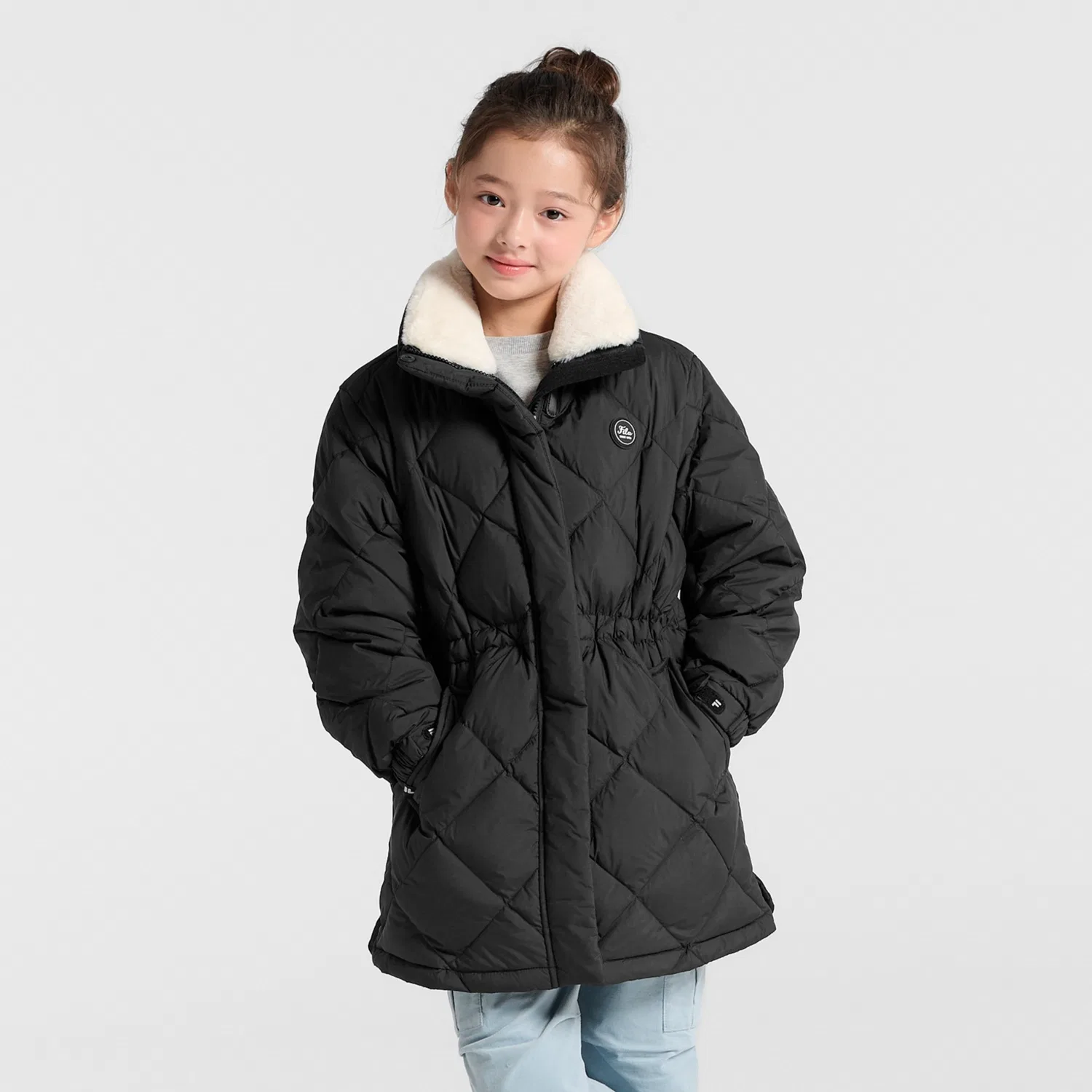 Детский лёгкий стёганый длинный пуховик чёрного цвета от Fila Kids