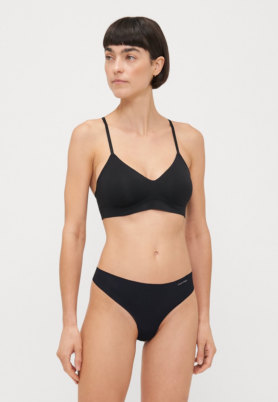 

Трусы Calvin Klein Underwear THONG INVISIBLES 5 PACK, Charming Green/Nymphs Thigh/Black/Multi-Coloured