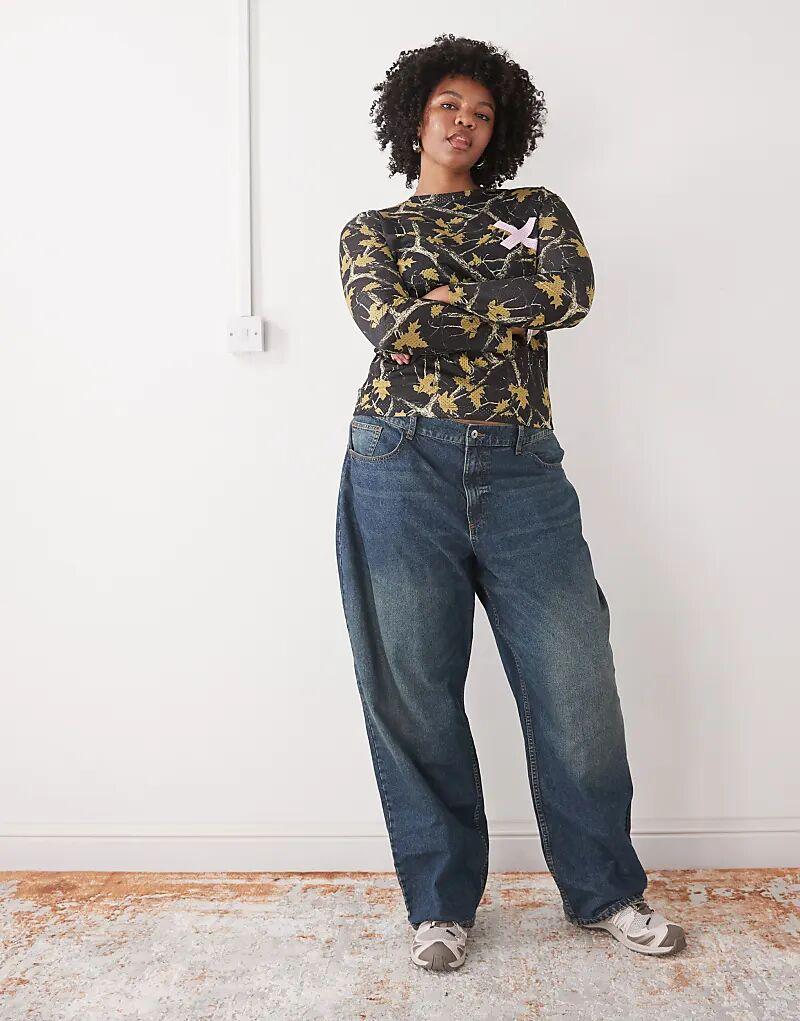 

COLLUSION plus лонгслив с длинными рукавами из искусственной кожи с камуфляжным принтом