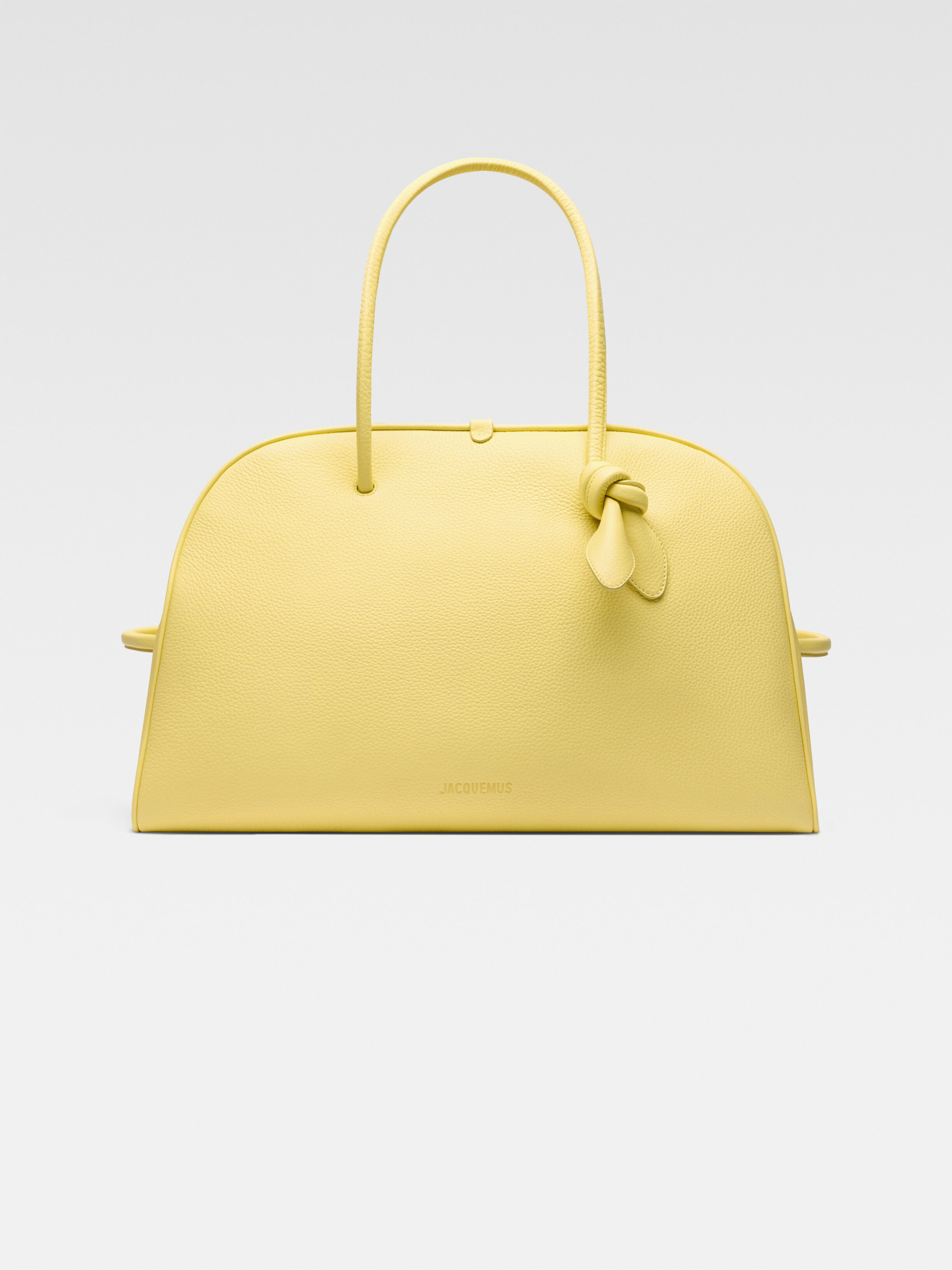 

Большая мягкая сумка для боулинга JACQUEMUS The large Turismo, светло-желтый
