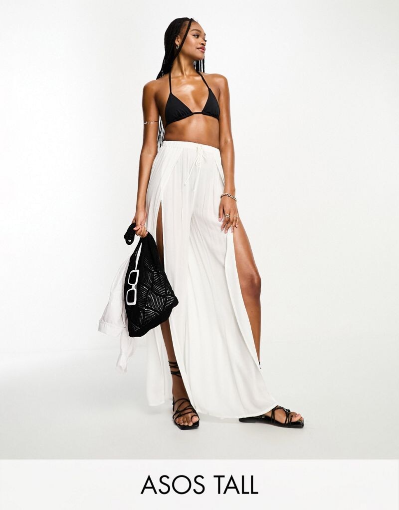 

Кремовые широкие пляжные брюки с высоким разрезом ASOS DESIGN Tall