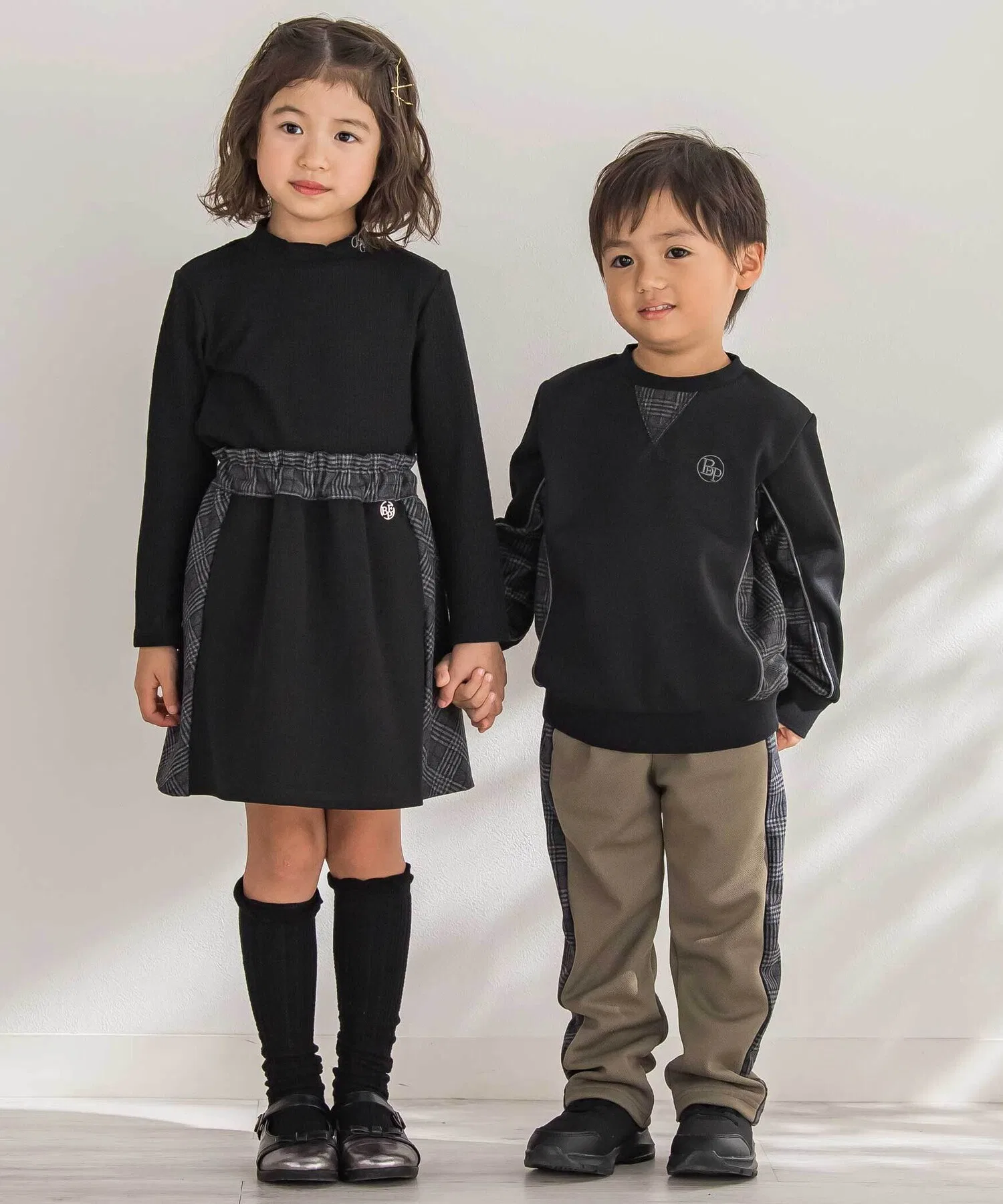 Детская юбка BeBe Petits Pois Vert в клетку с контрастной вставкой чёрная — фото 3