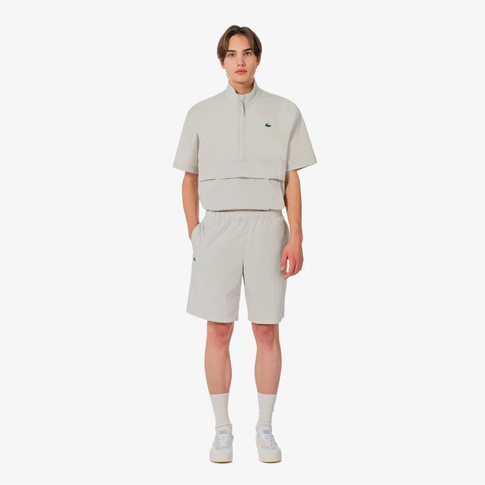 Мужские эластичные шорты из тканого материала бежевые от Lacoste — фото 4