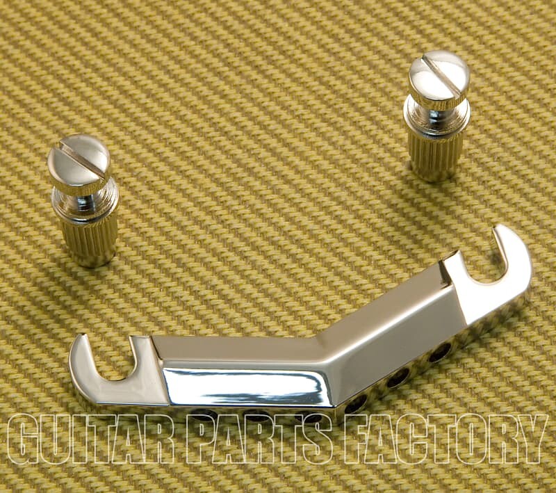 

770-9343-000 Gretsch Nickel V Stop Chevron Нижняя часть струнодержателя для гитары Streamliner 770-9343-000 Gretsch Nickel V Stop Chevron Guitar Tailpiece Streamliner