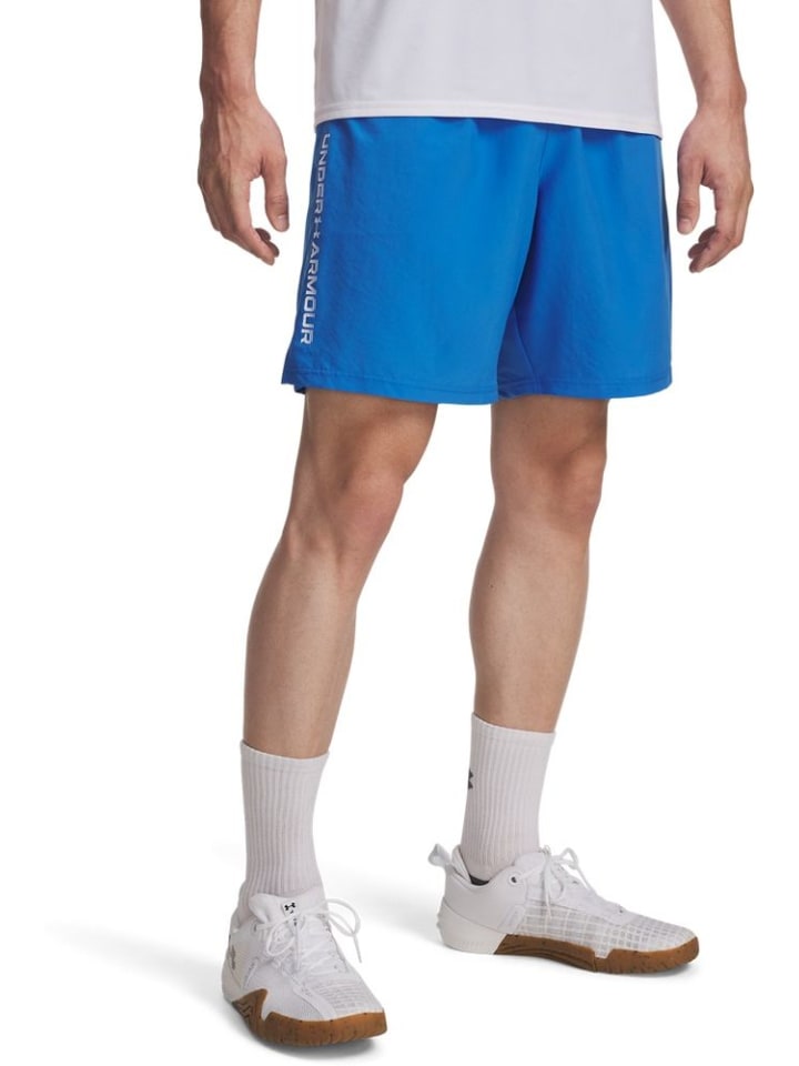 

Спортивные шорты Tech Woven Wordmark Shorts синего цвета Under Armour