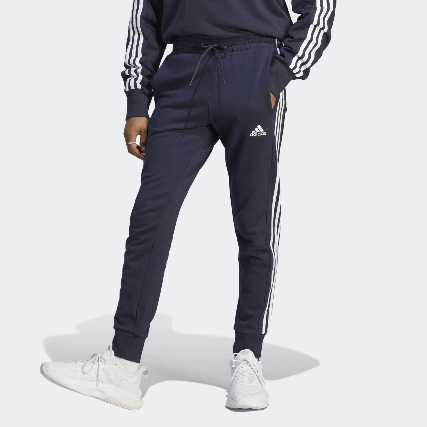Мужские спортивные штаны из футера с зауженным низом Essentials 3-Streifen French-Terry-Hose Adidas, Schwarz Weiss