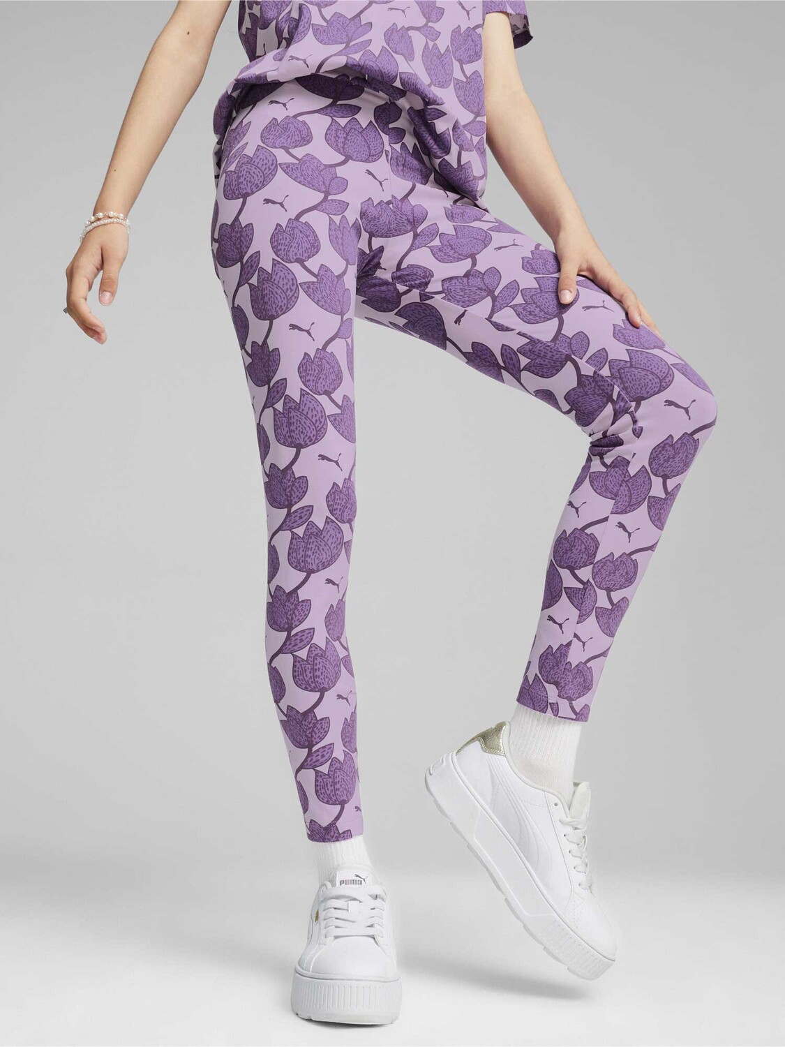 

Тайтсы Puma ESS+ BLOSSOM AOP Leggings G, фиолетовый