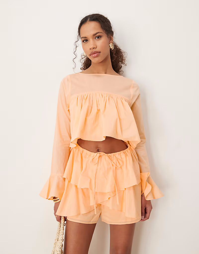 

Хлопковый комбинезон с вырезом и оборками ASOS DESIGN персикового цвета