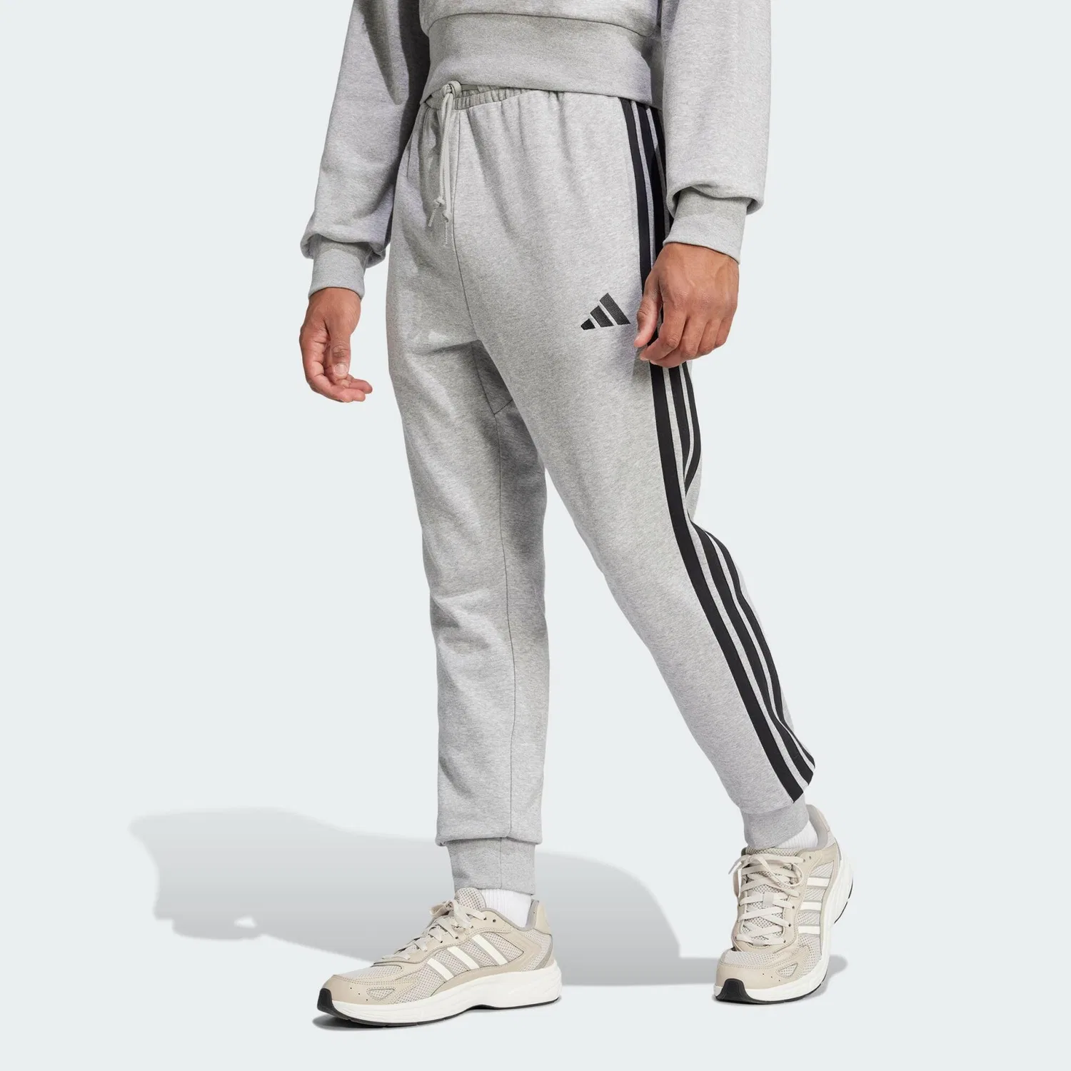 Женские спортивные брюки с зауженным кроем Essentials 3-Streifen French Terry Hose Adidas, Цвет: Grau Schwarz Grau
