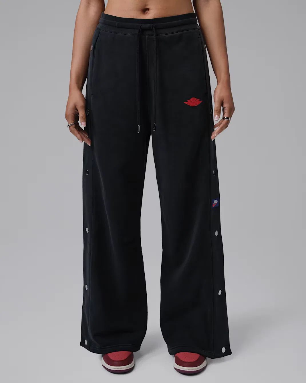 Женские брюки из французского трикотажа на кнопках Jordan Flight Fleece, Black/University Red