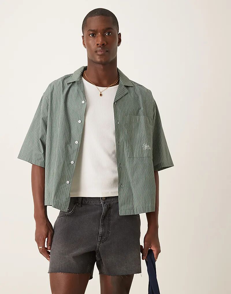 

Укороченные узкие джинсовые шорты ASOS DESIGN с рваными деталями черного цвета