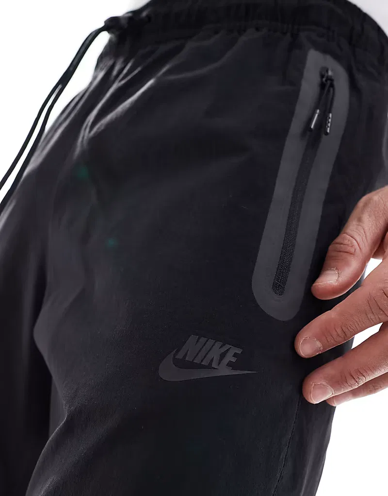 Зауженные брюки Nike Tech Woven, черный — фото 4