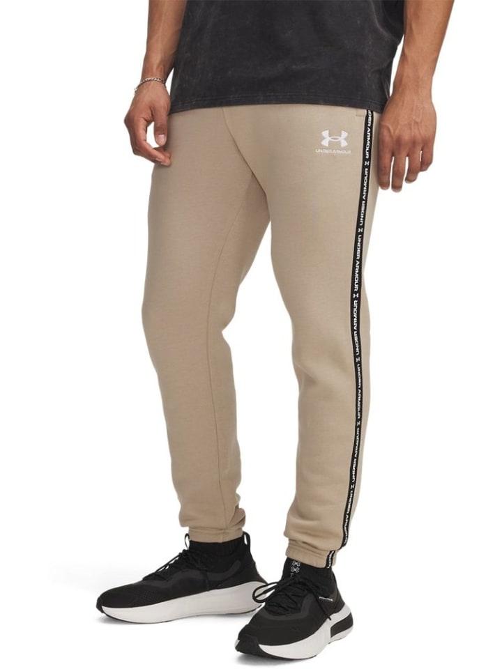 

Спортивные брюки Icon Fleece Taping Jogger коричневого цвета Under Armour