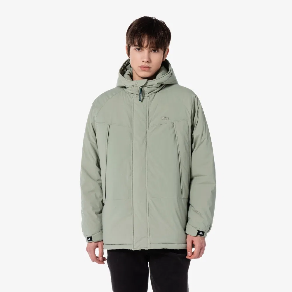 Мужской длинный пуховик с капюшоном серого цвета от Lacoste