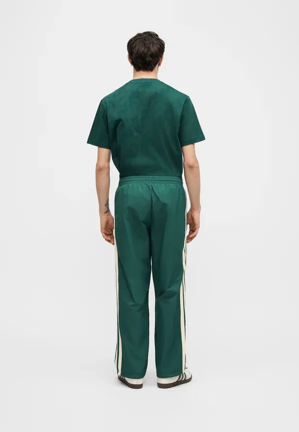 Брюки Adidas Originals, зеленый — фото 4
