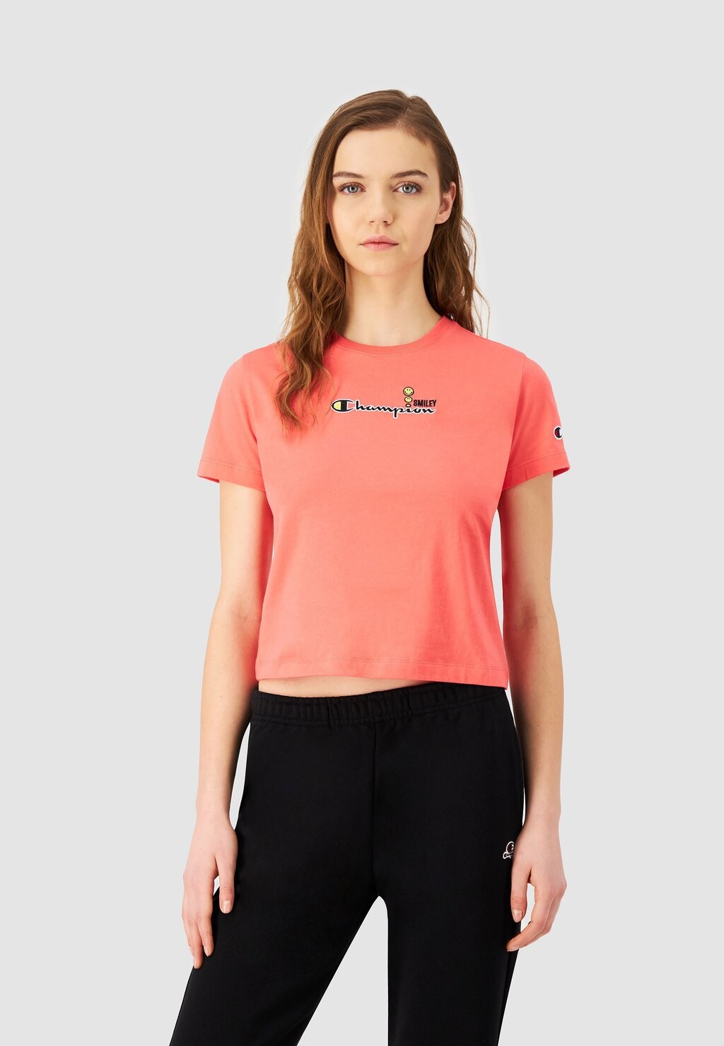 

Футболка с принтом SMILEY CREWNECK Champion Rochester, коралл