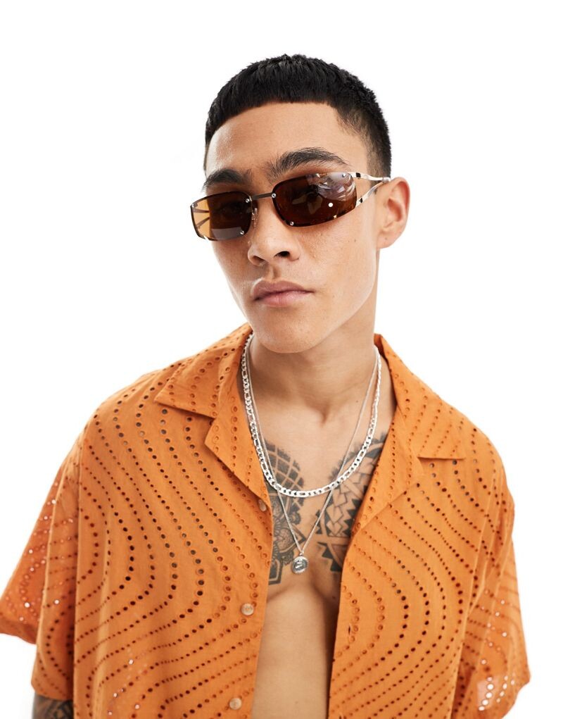 

Золотые солнцезащитные очки без оправы с коричневыми линзами ASOS DESIGN