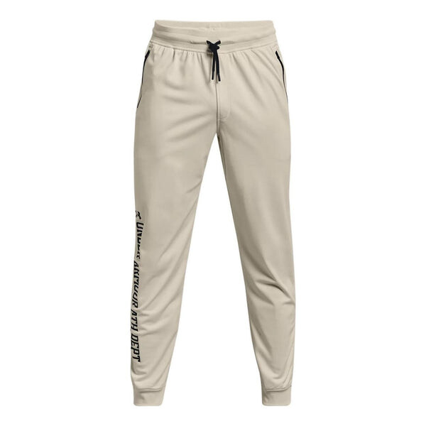 

Брюки sportstyle tricot graphic pants 'beige' Under Armour, бежевый