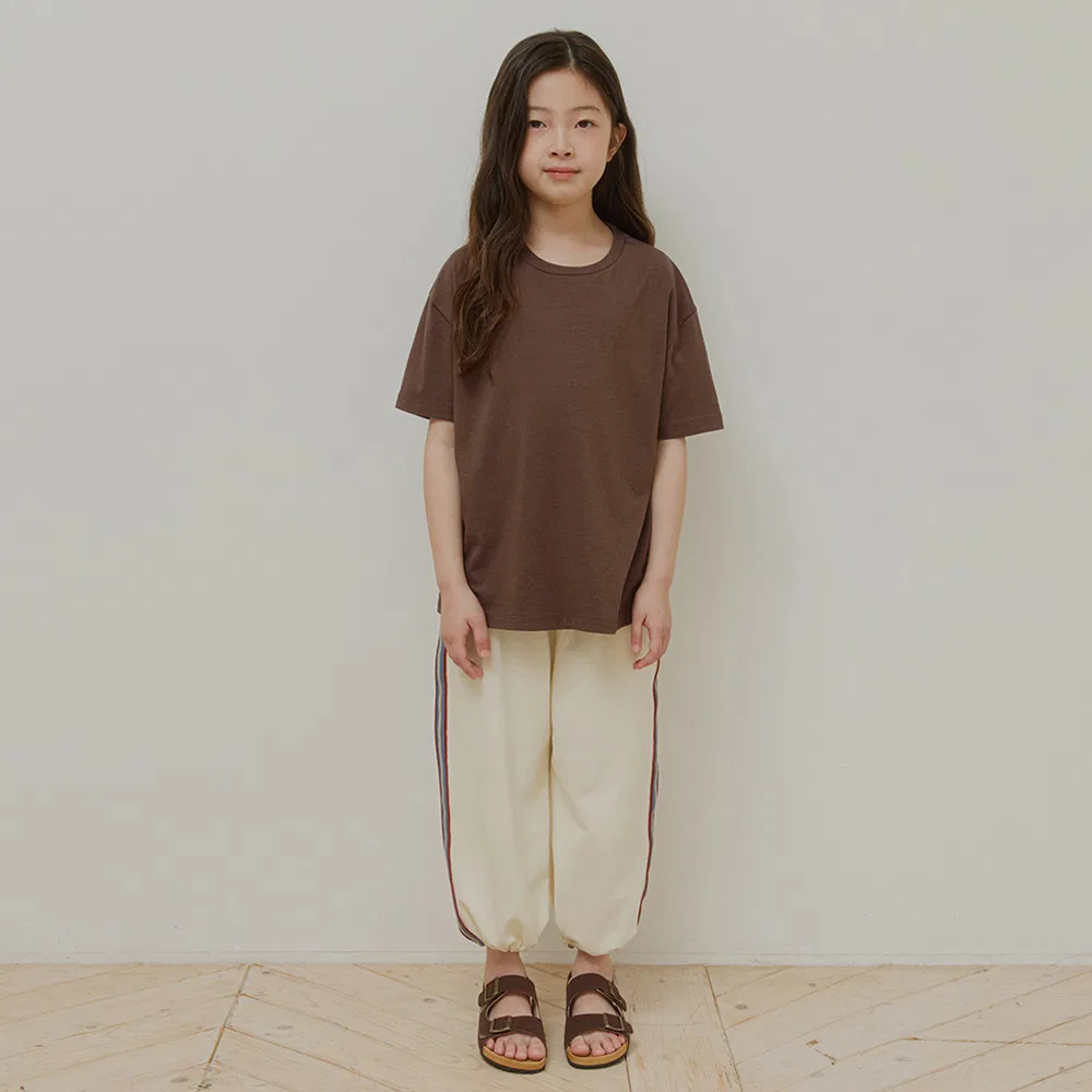 Детские спортивные брюки Lumi Line кремового цвета от Wednesdayoasis Kids — фото 4