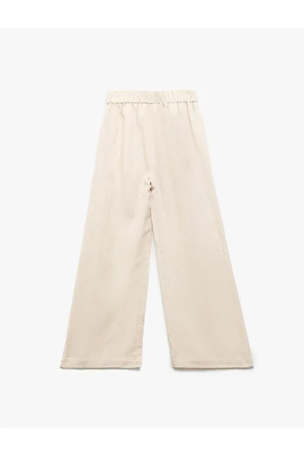 Детские широкие брюки для девочек с карманами Elastic waist pocket detailed palazzo trousers Koton, Ecru — фото 2