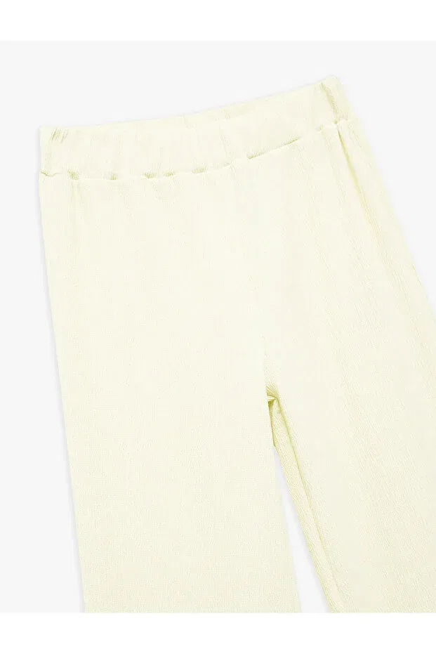 Детские брюки для девочек широкие с эластичным поясом Viscose blended wide leg trousers with elastic waist Koton, Yellow — фото 3