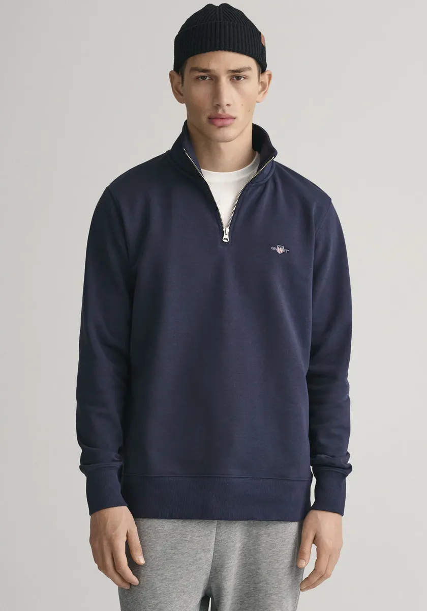 

Толстовка Gant "REG SHIELD HALF ZIP SWEAT" с вышитым логотипом на груди, синий