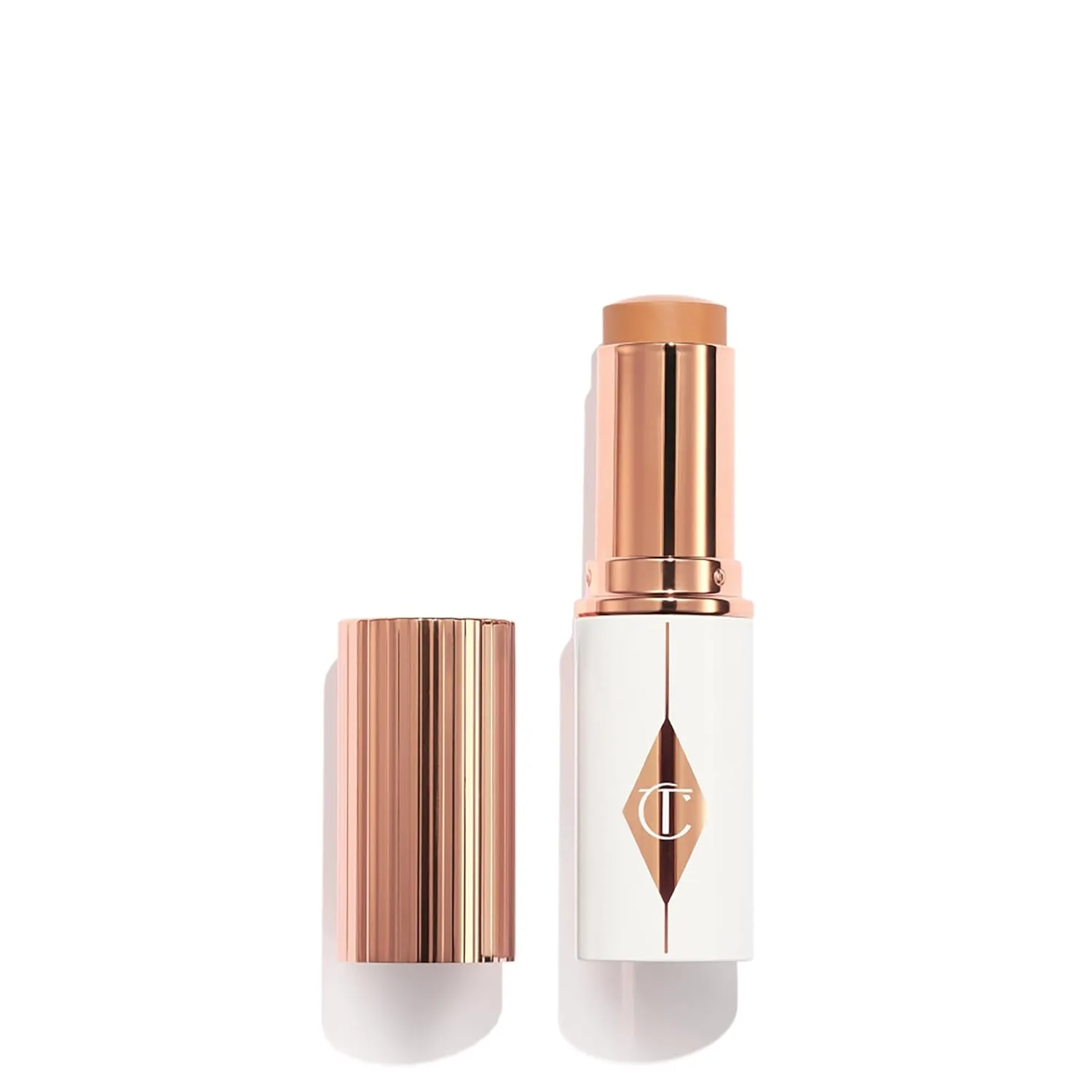 Charlotte Tilbury Unreal Skin Tint & Sheer Glow Hydrating Foundation Stick - кремовая тональная основа с легким покрытием и увлажняющим эффектом, 08 Medium - Medium-tan with warm undertones