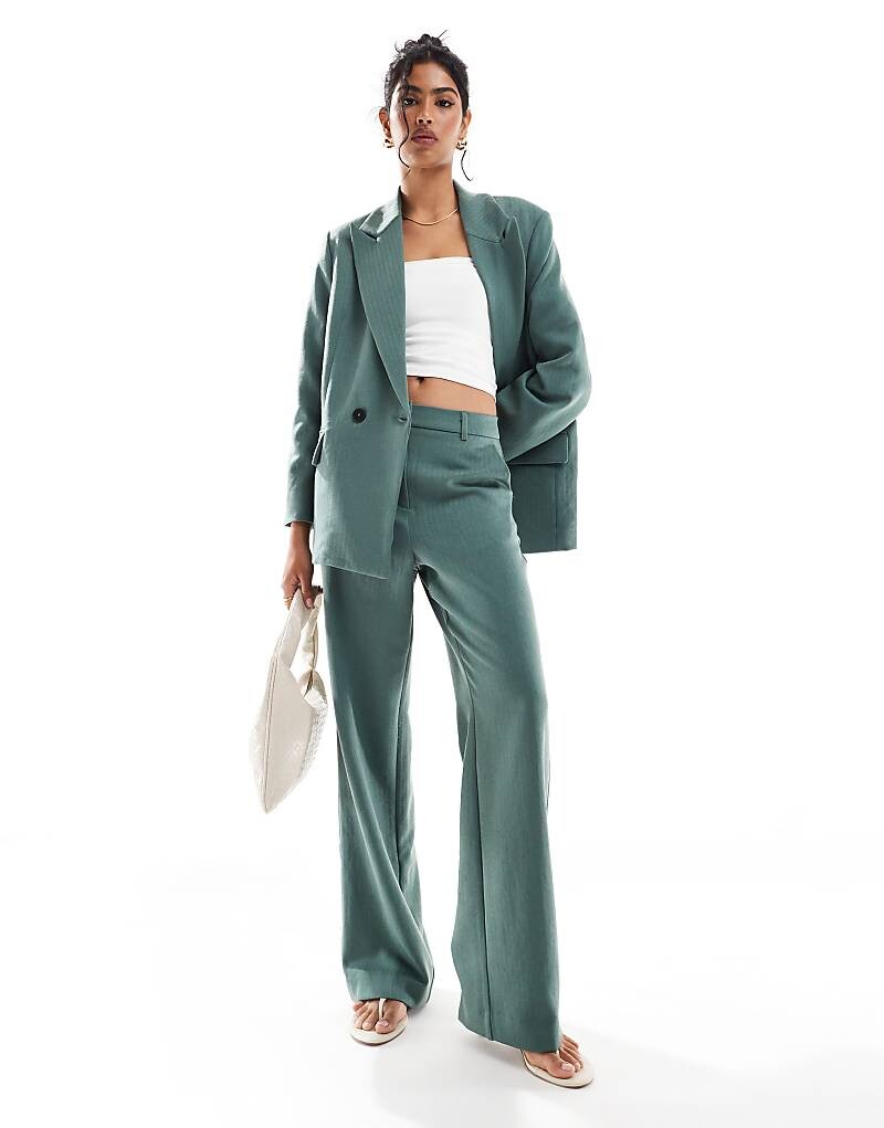 

Темно-зеленые брюки строгого кроя с узором «елочка» Vero Moda