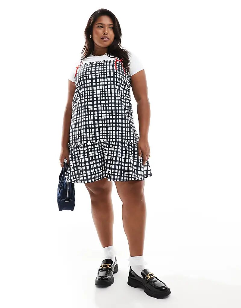 

Эксклюзивное мини-платье Renee Studio Plus x Holly Wynne с бантом из ленты и рукавами-камиль, подолом-пеплум в серую клетку