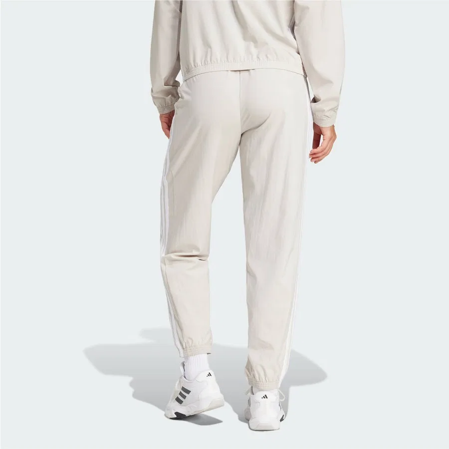 Спортивные штаны с эластичным поясом и зауженными брючинами Train Essentials 3-Stripes Woven Pants adidas, Бежево-белый — фото 2