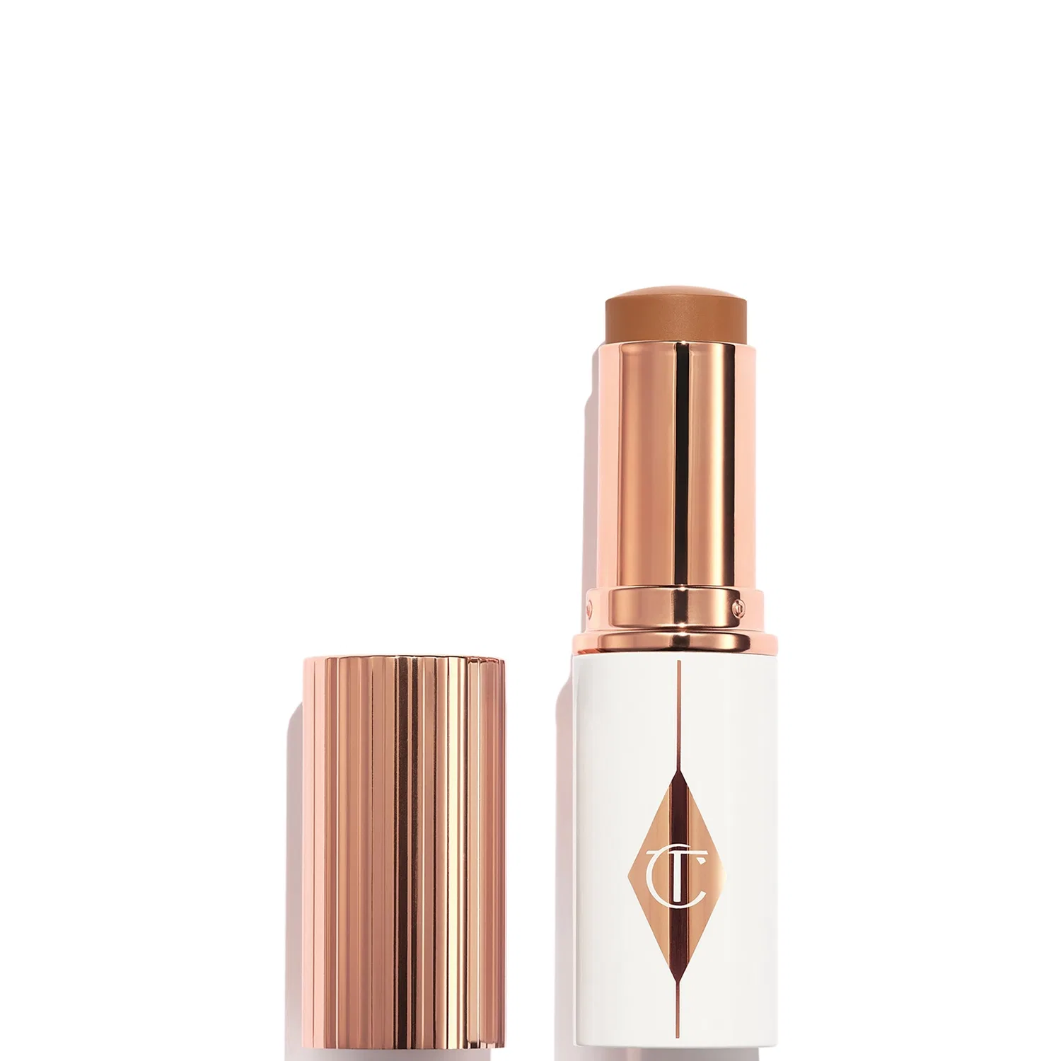 Тональный стик Unreal Skin Sheer Glow Tint Charlotte Tilbury, 10 г, Shade 12.5 Tan