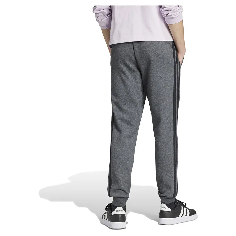 Брюки флисовые с лампасами Adidas Essentials 3 Stripes Fleece joggers, серый — фото 2