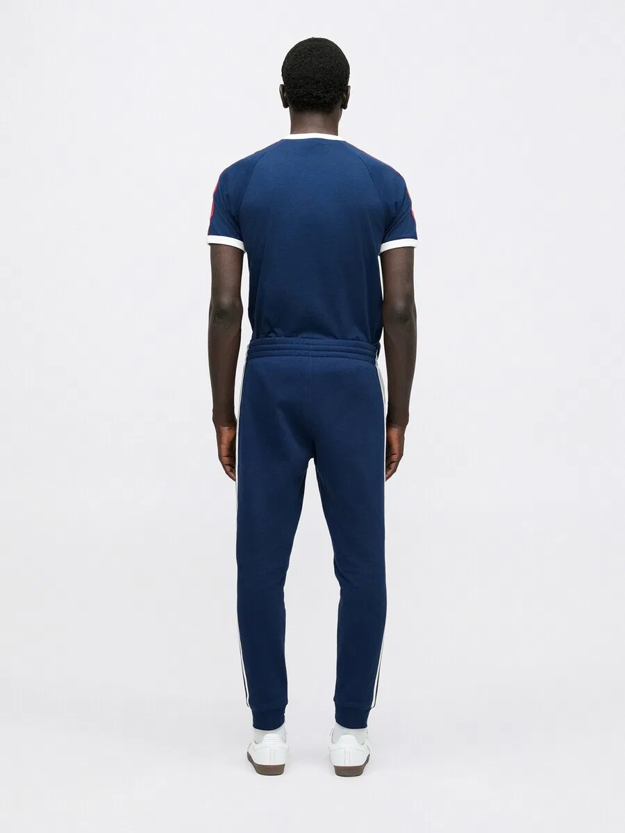 Зауженные брюки ADIDAS ORIGINALS темно-синего цвета — фото 4