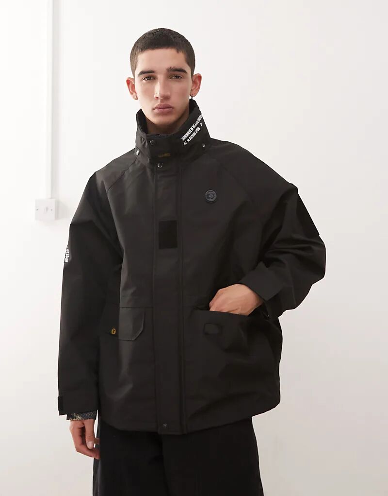 

Водонепроницаемая куртка-дождевик Aape by A Bathing Ape черного цвета с нанесенным логотипом