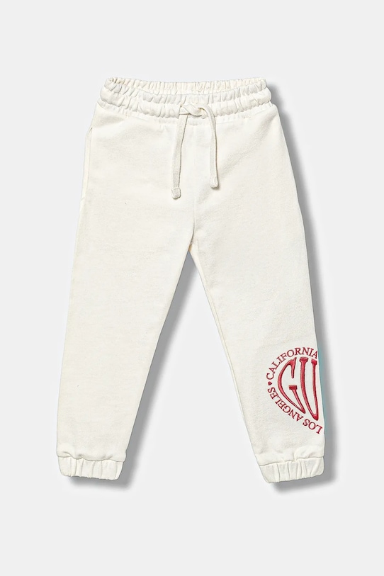 

Детские хлопковые спортивные брюки Guess, бежевый